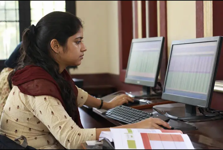 A learner practising computer skills at a training centre